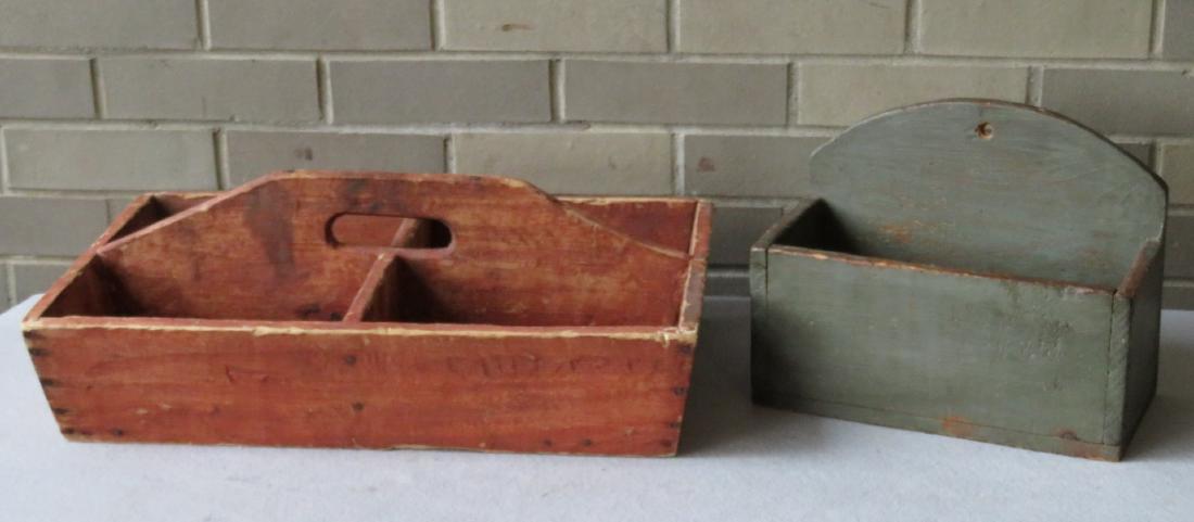Two country treenware collectibles including primitive: Two country treenware collectibles including primitive tool carrier in original red paint - 20"W x 12.5"D and a wall hanging salt box in old green paint - 11.75"W x 6"D x 9"H. Both appear to be mid to
