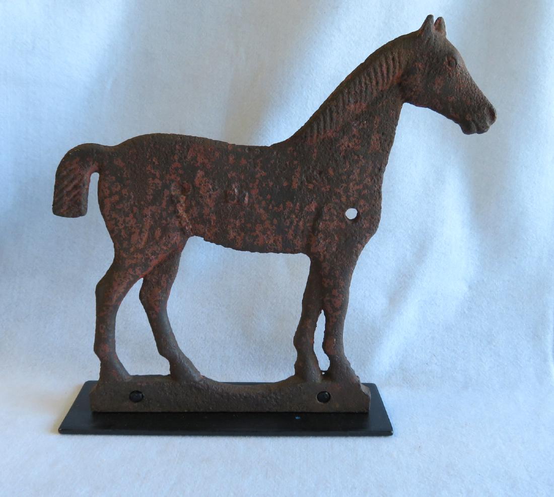 Cast iron horse windmill weight, attributed to the: Cast iron horse windmill weight, attributed to the Dempster Mill Manufacturing Co., Beatrice, NE - marked with an embossed "58". The horse with a short tail, has traces of original red paint - some ex