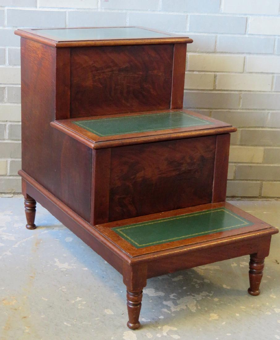 English mahogany library & bedstead steps with tooled: English mahogany library & bedstead steps with tooled leather tops and turned feet - the top step with lift top storage compartment and the mid step pulls out to expose a hidden commode - circa 1810-2