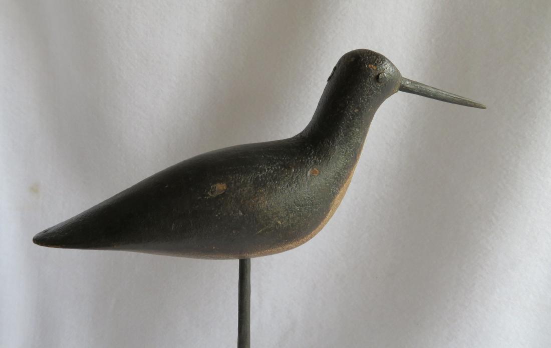 Yellowlegs shore bird decoy - good form and appears to: Yellowlegs shore bird decoy - good form and appears to retain original paint - wooden beak is mortised through head - tack eyes - 2 small shot holes in body and 1 in head - very old and small worn chi