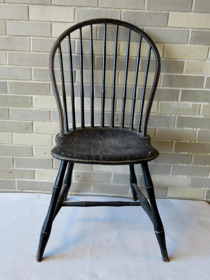 Bow back Windsor side chair having 9 spindles - seat: Bow back Windsor side chair having 9 spindles - seat with old repair to split - old, but later black paint over original red. Good condition.