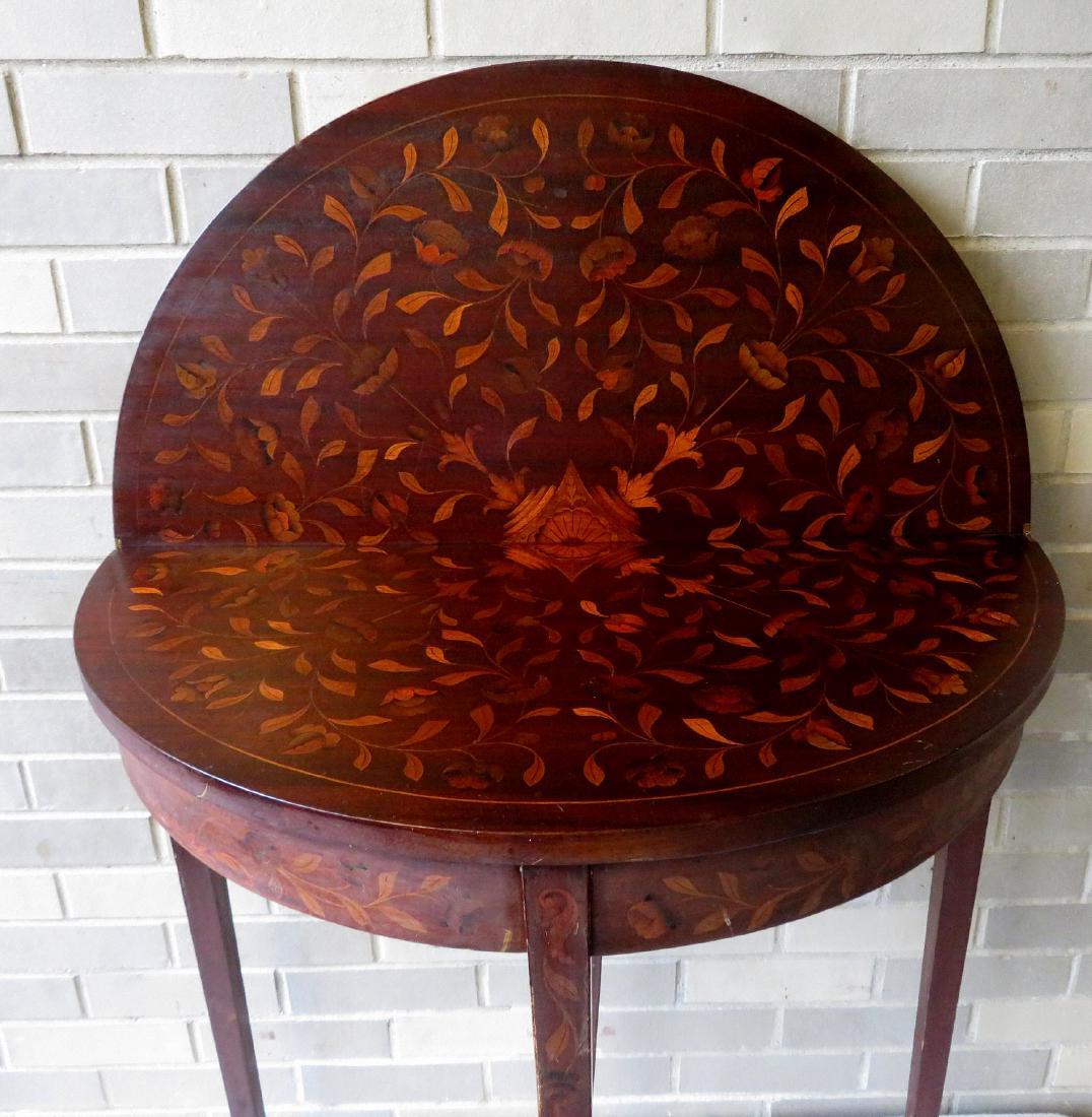 Hepplewhite style marquetry inlaid flip top game table,: Hepplewhite style marquetry inlaid flip top game table, with hidden drawer for holding game pieces - with top open, the inlay includes flowers, leaves and central medallion - in closed position the ma