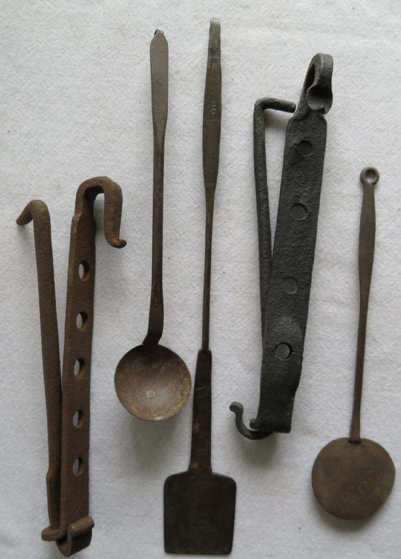 Grouping of 5 hand forged iron hearth and kitchen tools: Grouping of 5 hand forged iron hearth and kitchen tools including 2 trammels, ladle 14.5"L, spatula marked EB-BD - 19.75"L, and a smaller spatula 13"L. All in very good condition, late 19th to early 2