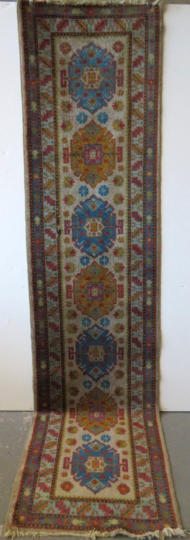 Oriental runner, 9' 6" x 2' 4". Early 20th century.: Oriental runner, 9' 6" x 2' 4". Early 20th century. Slight loss in the corner of one end, "L' shaped 5" tear, and a small 1" tear, good colors, tears hardly noticeable, overall good condition.
