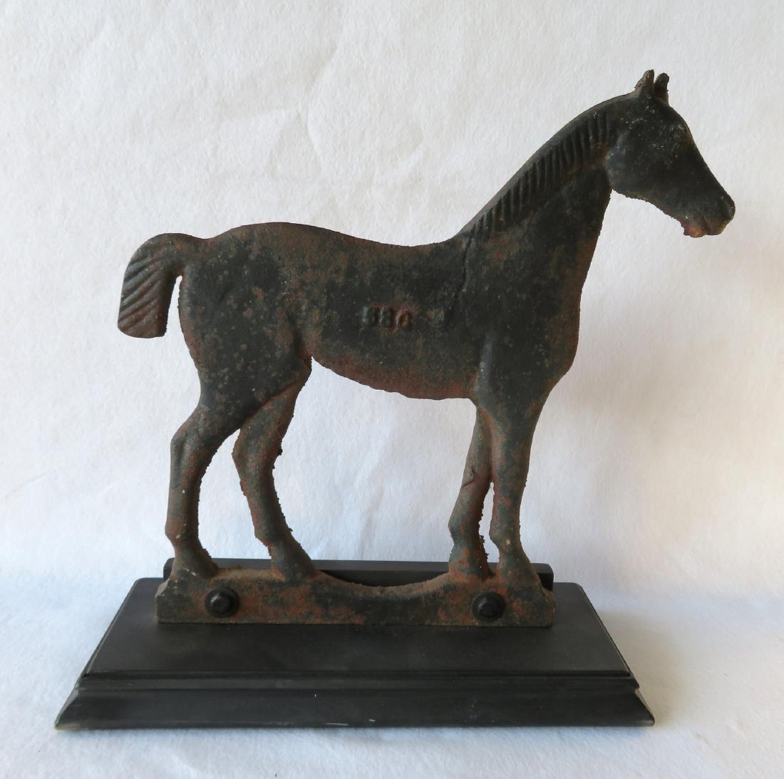 Cast iron windmill weight in the form of a standing: Cast iron windmill weight in the form of a standing horse with a bobtail, and embossed number 58C on its side - original black paint - attributed to Dempster Mill Manufacturing Co, Beatrice, NE - 16.5