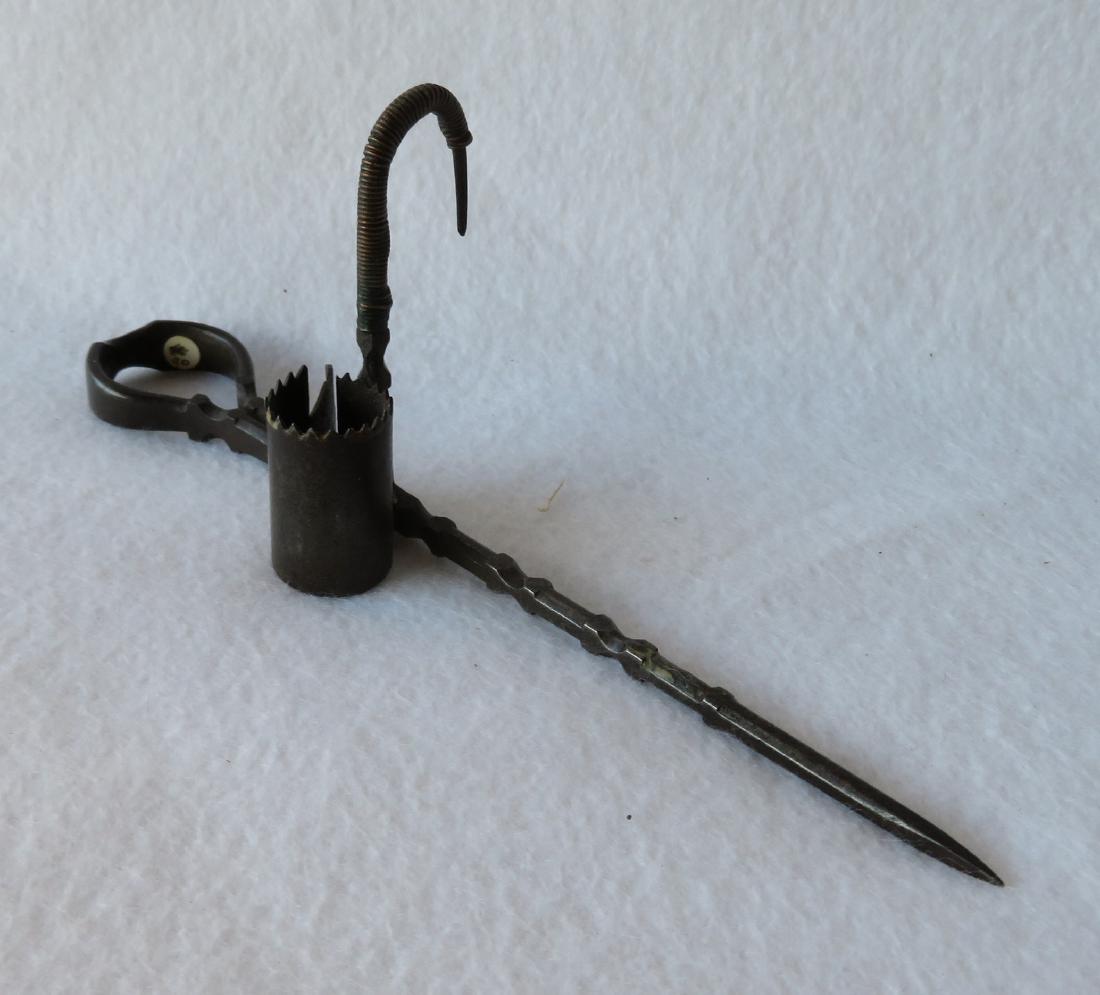 Sticking Tommy candlestick, hand forged iron with: Sticking Tommy candlestick, hand forged iron with unusual shaped frame - note copper wire wrapping around hook which may have been added for strength or for an old repair - 8"L. 18th/19th century. Ver
