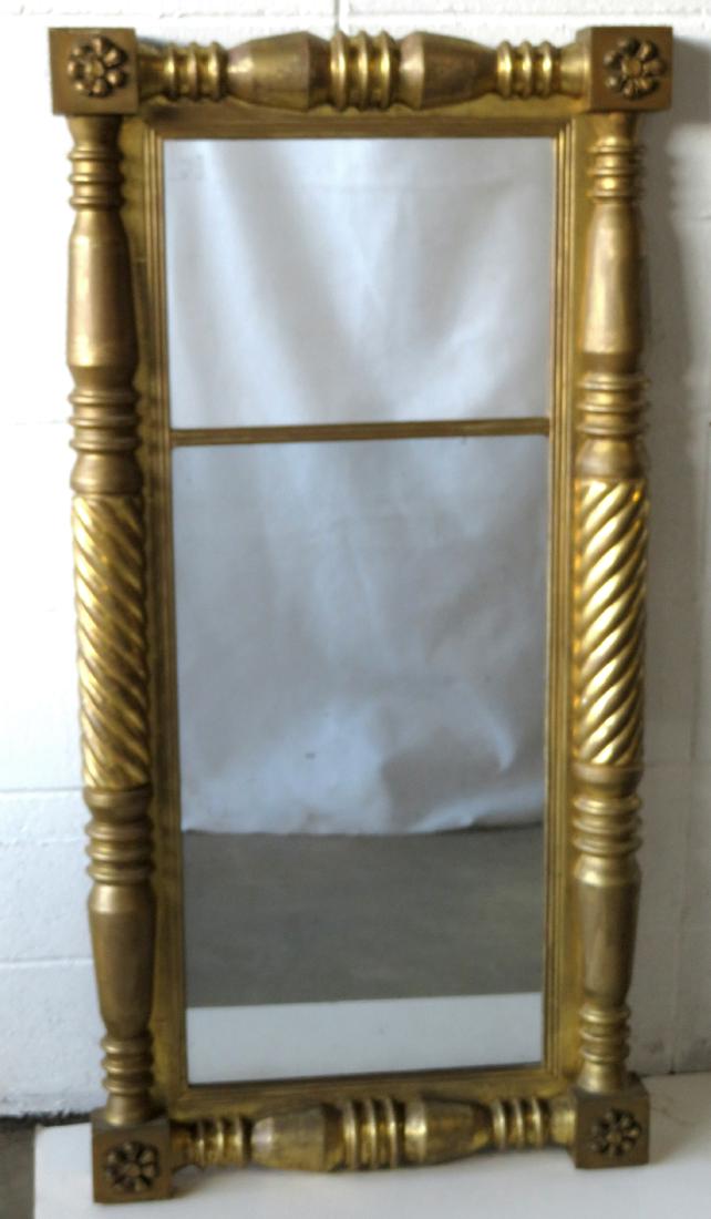 Large Sheraton double panel wall mirror having twisted: Large Sheraton double panel wall mirror having twisted 1/2 columns on each side of mirror and gesso rosettes in each corner - old gold leaf paint with some touchup - 24" x 48". Circa 1820-40. Very goo