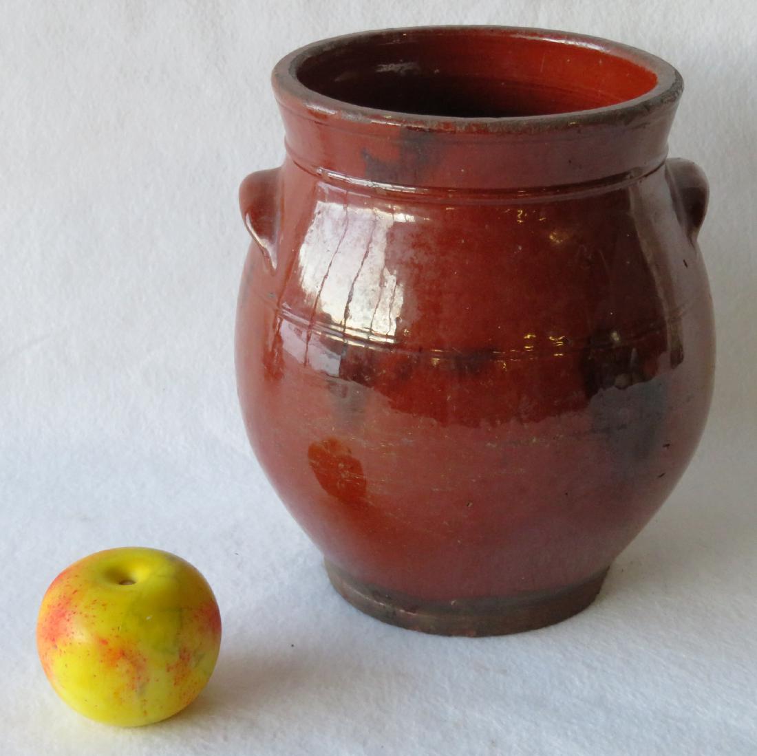 Redware ovoid storage jar with handles and manganese: Redware ovoid storage jar with handles and manganese decorations -10"H x 9"D. Very slight surface scratches, several small chips on rim of base, overall very good condition. Early 19th century.