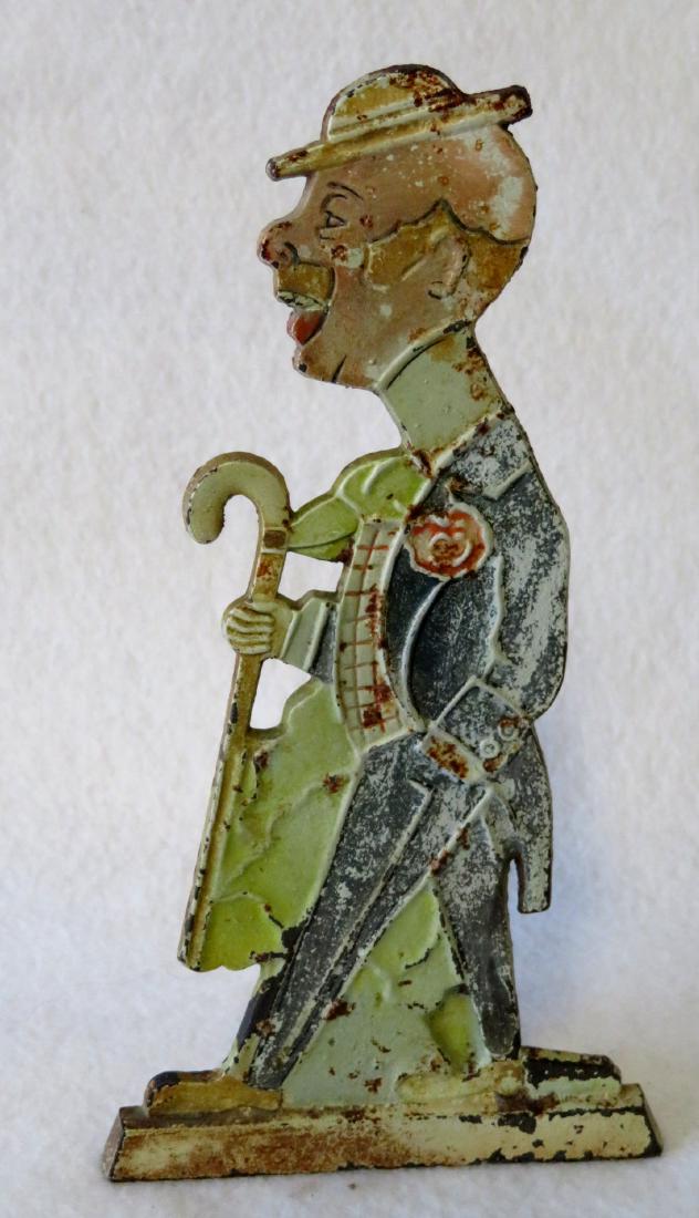 Dapper Dan cast iron figural door stop in original: Dapper Dan cast iron figural door stop in original slightly worn paint by H.L. Judd Co., New Britain, CT. Impressed number 1256 on reverse. Very good condition. 7.25"H.