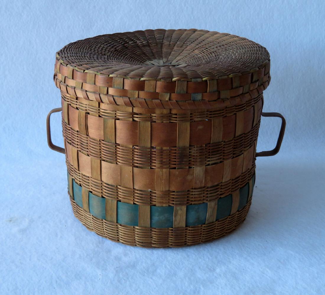 Native American covered sewing basket with handles on