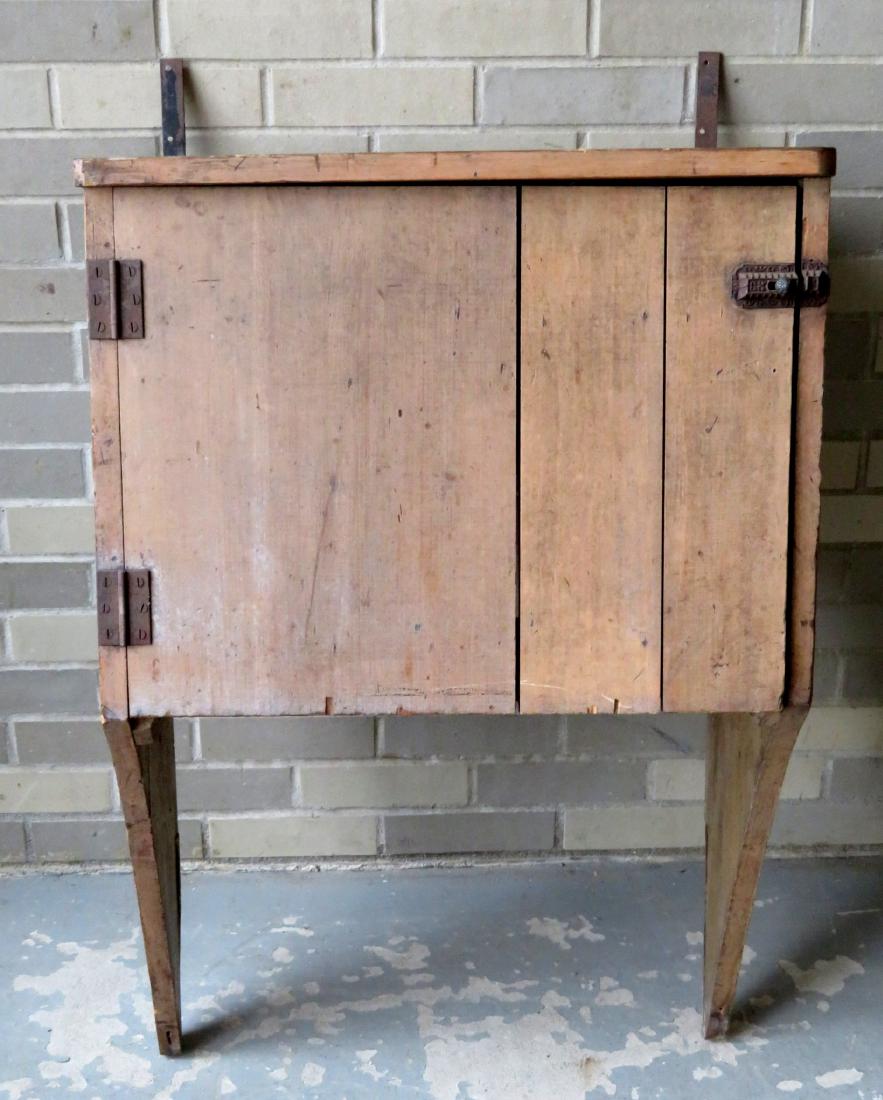 Hanging single door wall cupboard in original paint - 3: Hanging single door wall cupboard in original paint - 3 very narrow shelves over a 7"H shelf - late 19th century - 24"W x 40"H x 15"D.