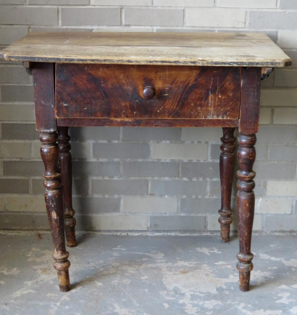 Pennsylvania grain painted work table with center: Pennsylvania grain painted work table with center drawer on turned legs and having a removable scrubbed top with chamfered border. Some paint loss on legs, but overall good condition. Circa 1820. 31"W