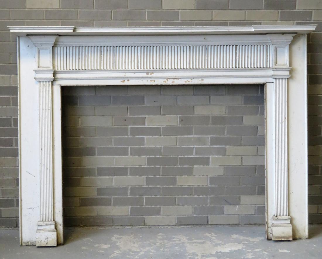 Federal fireplace mantle with fluted and paneled front: Federal fireplace mantle with fluted and paneled front with shaped top shelf and reeded columns each side of opening. Early 19th century. 72"W x 53.25"H x 8"D - the opening 50"W x 39"H. Several layers