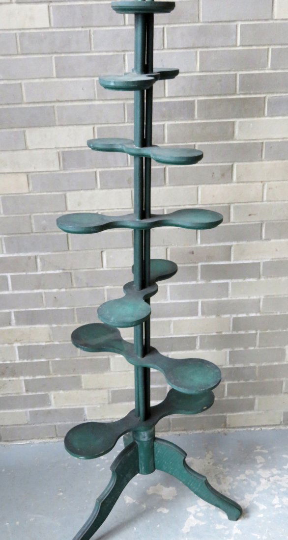 Unusual country store display stand in original green: Unusual country store display stand in original green paint, late 19th century, having 6 propeller shaped platforms/tiers in graduated sizes from 15"W to 20"W extending from post on a tripod base - he
