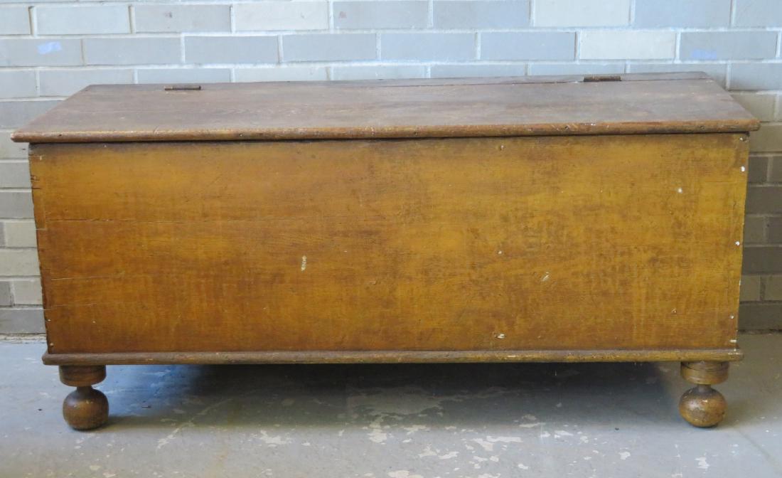 Mustard colored grain painted grain box on ball feet in: Mustard colored grain painted grain box on ball feet in original paint - early to mid 19th century - very good original condition. Size 52"L x 21.5"D x 23.5"H.