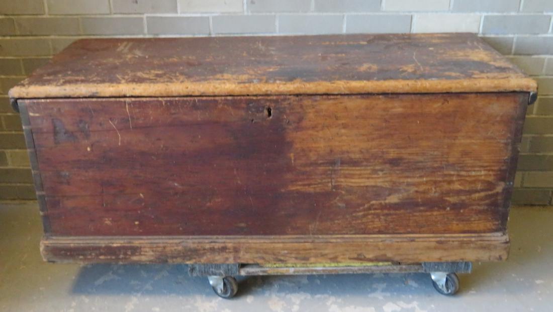 Primitive pine sea chest/cellarette with beckets,: Primitive pine sea chest/cellarette with beckets, interior till on left with drawer beneath, sliding interior till on right over a hidden liquor storage compartment. Retains 3 original hand forged iro
