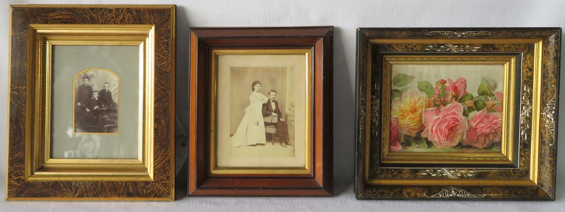 Three beautiful Victorian picture frames, all with gold: Three beautiful Victorian picture frames, all with gold insets. Frames of various sizes and each will hold an image 8" x 10". One with a photograph of a man and woman stamped on vase VanWagner. All in