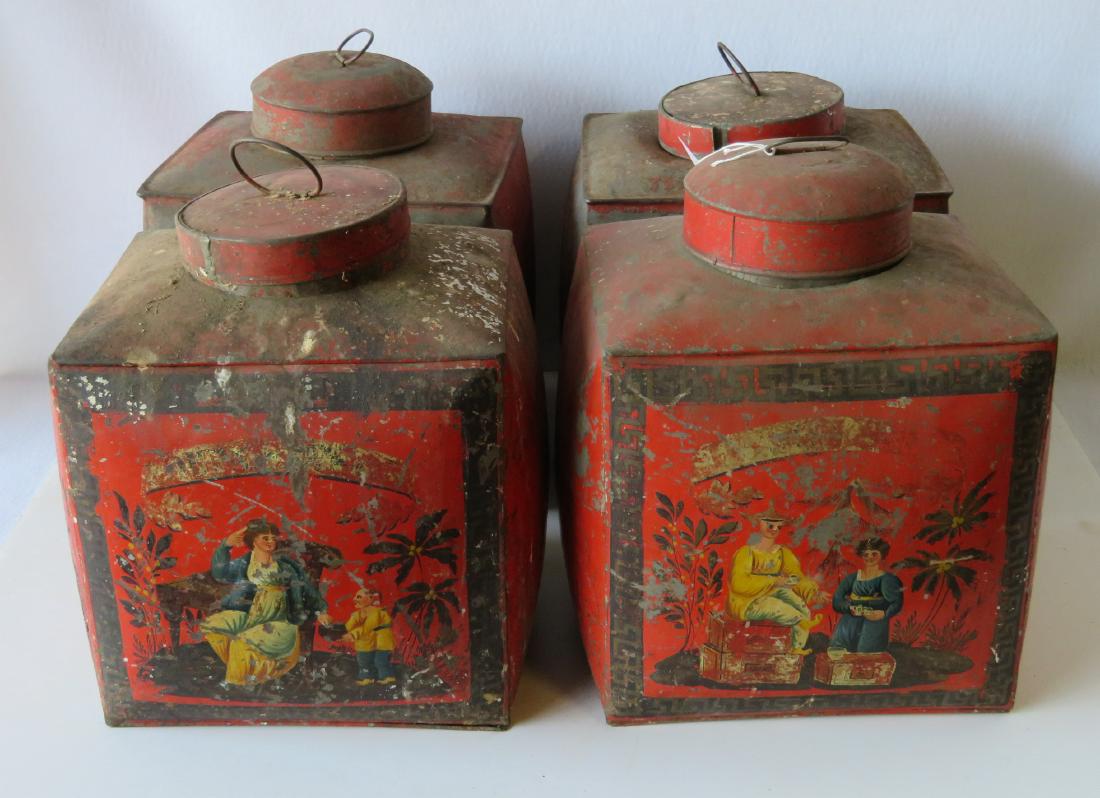 Four tin oriental tea bins in original red paint with: Four tin oriental tea bins in original red paint with hand painted figures and banner on front panel:1) Scene depicts an oriental man handing a tea box to a seated Eastern lady - banner not readable, 