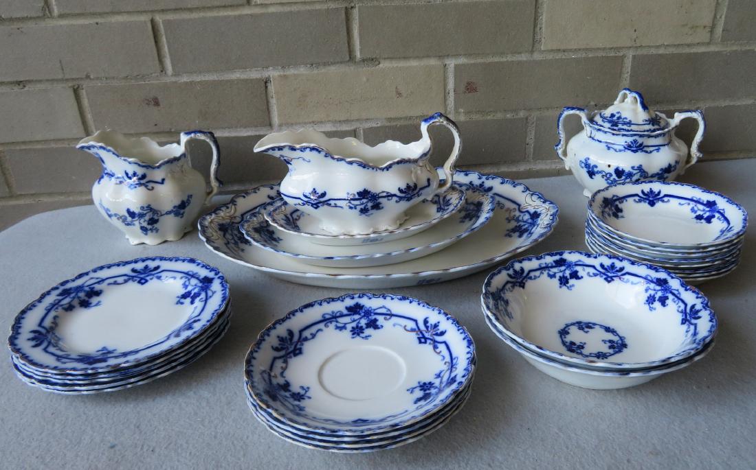 Grouping of signed Johnson Bros - England, flow blue: Grouping of signed Johnson Bros - England, flow blue china in the Oxford pattern. There are 25 pieces with no damage including 3 platters ranging in size fro 8"L to 14.5"L, 1 sugar, 1 creamer, 1 gravy
