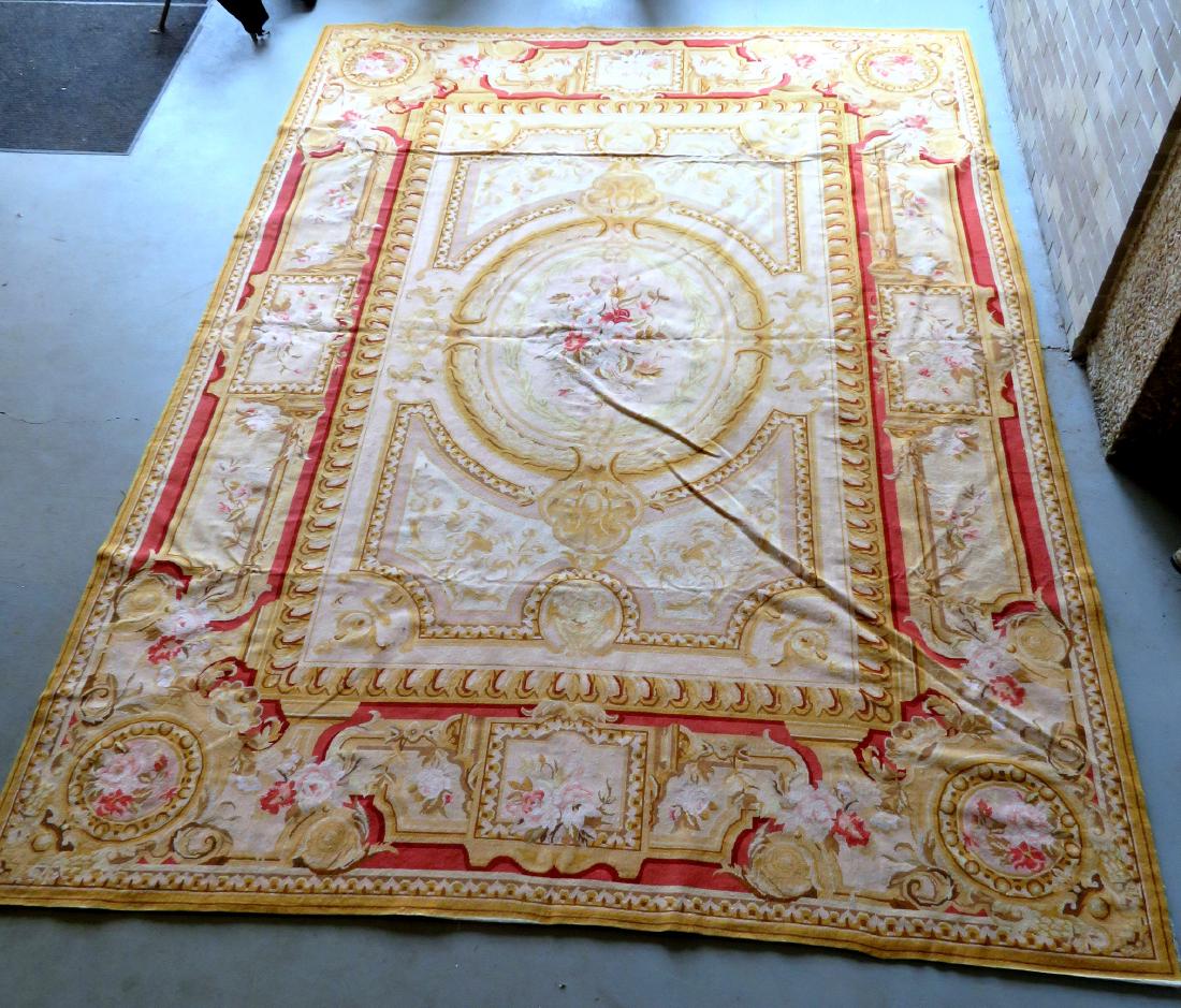 Classical aubusson-baroque style floral needlepoint: Classical aubusson-baroque style floral needlepoint room size rug, in the form of a painted ceiling 9' 9" x 13' 8". Very good condition. Mid 20th century. Comes with felt carpet backer of the same siz