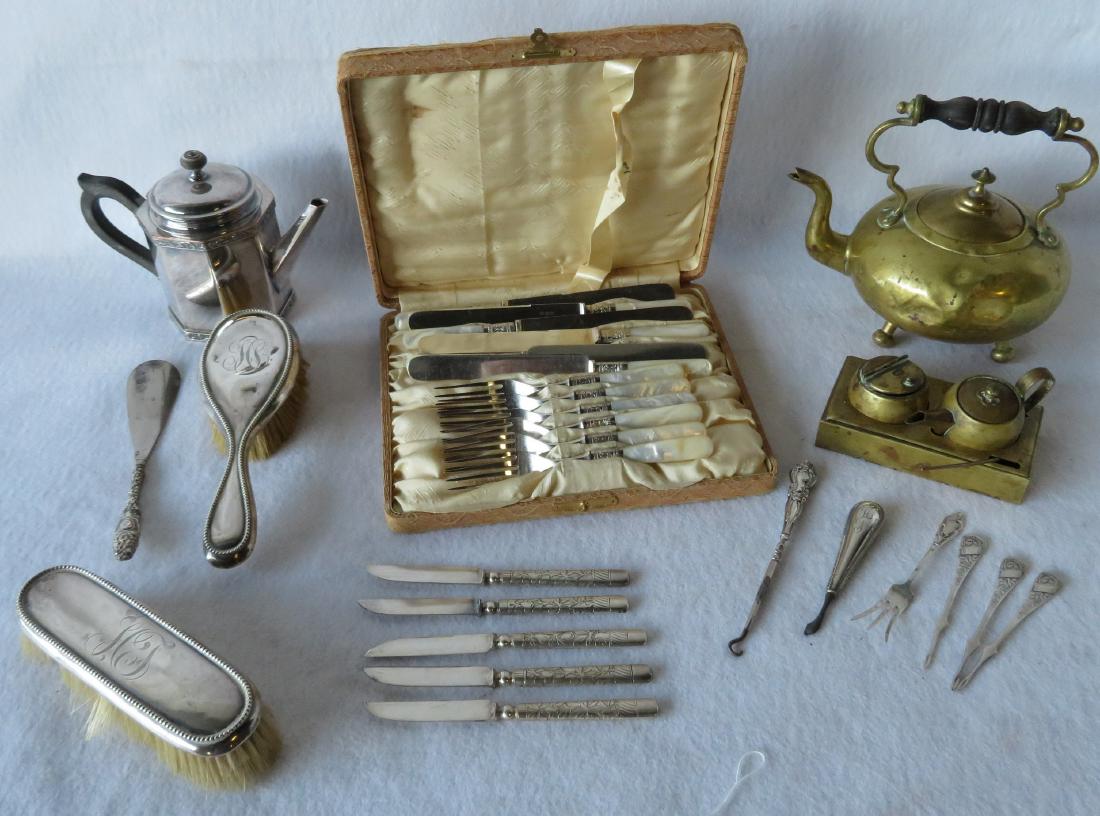 Grouping of decorative objects including boxed luncheon: Grouping of decorative objects including boxed luncheon set of 6 butter knives and 6 forks with mother of pearl handles, 2 Sterling hair brushes, sterling serving fork, sterling button hook, sterling