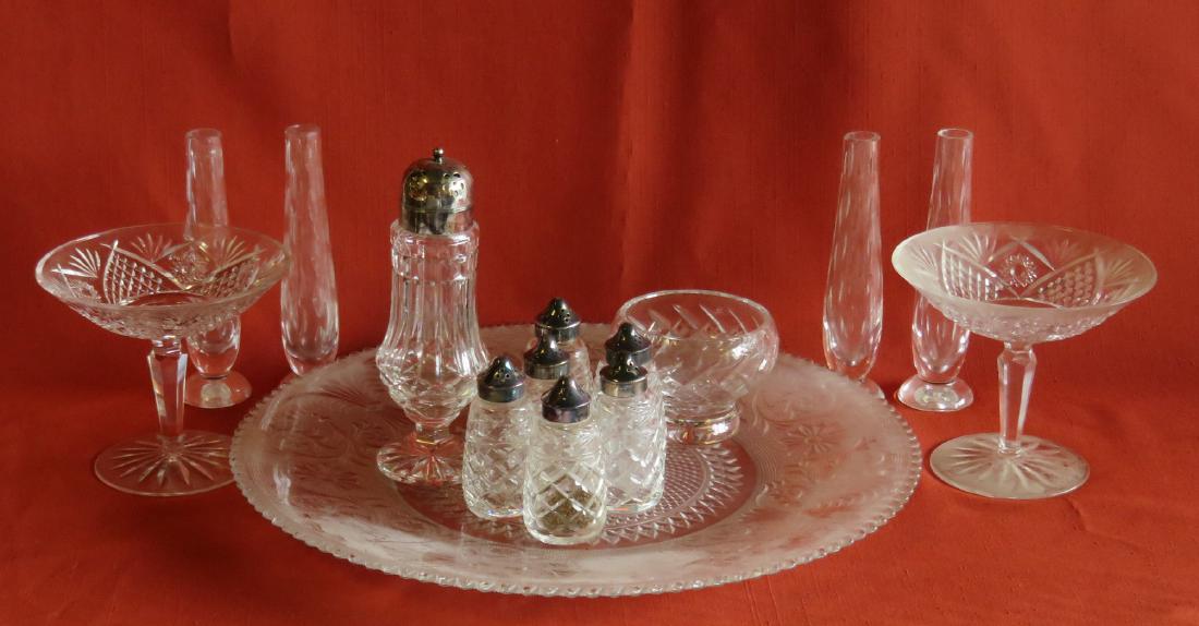 Grouping of 13 pieces of signed Waterford crystal: Grouping of 13 pieces of signed Waterford crystal including 2 footed compotes 5 1/2"H, 4 bud vases 7"H, 6 salt & pepper shakers 3 3/4"H, and muffineer with silver plated lid 7 3/4"H. Lot also includes