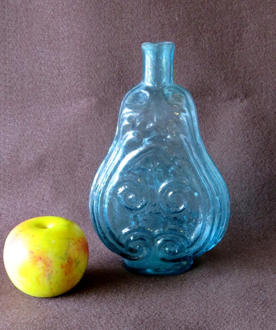 Large hand blown open pontil scroll flask in a light (1 of 6)
