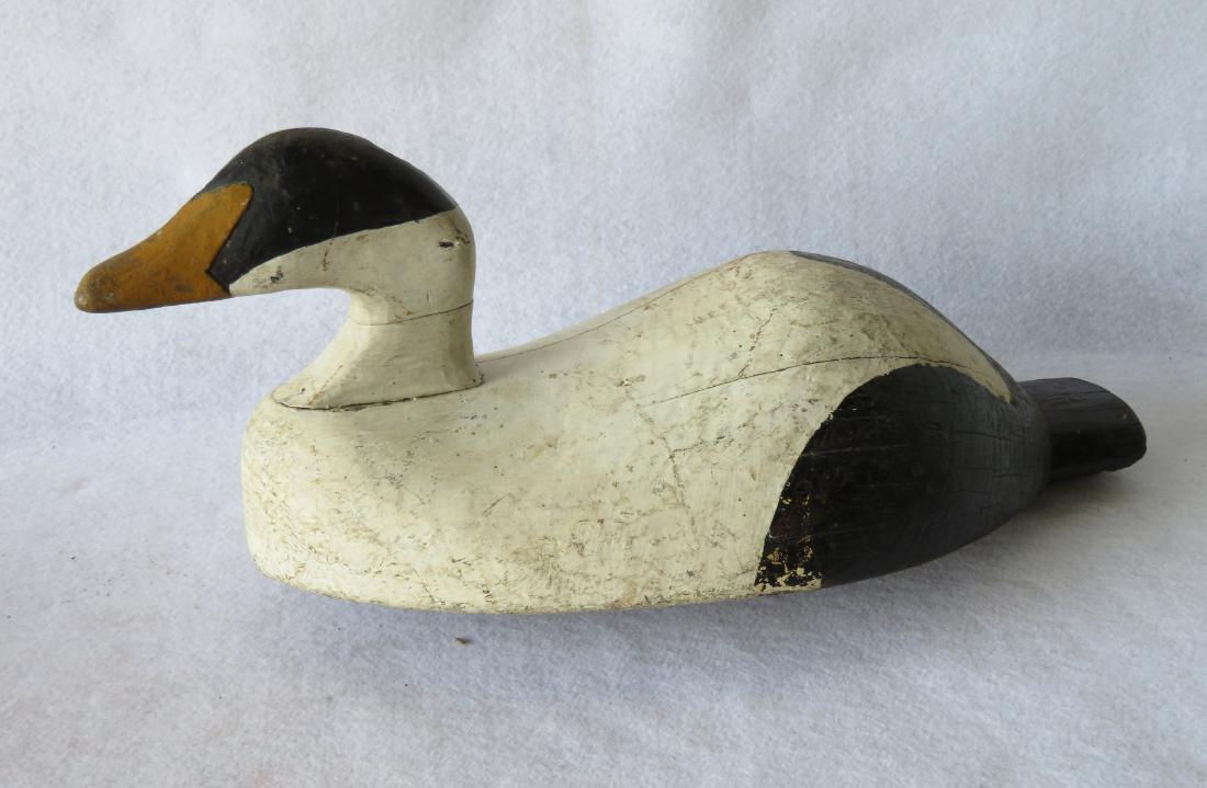 Folkart Eider decoy with solid carved body and hump (1 of 5)