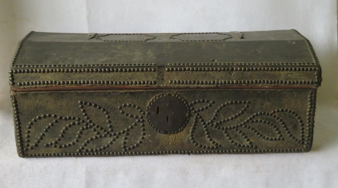An early leather covered wooden trunk decorated with (1 of 6)