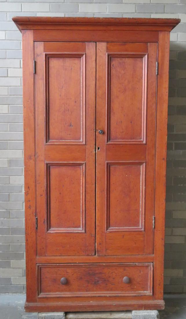 Pine cupboard having 2 paneled doors over a long drawer (1 of 4)