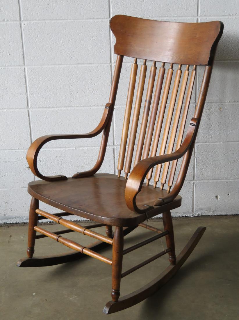 Oak rocker with 8 vertical spindles. Late 19th to early: Oak rocker with 8 vertical spindles. Late 19th to early 20th century. Very good condition.