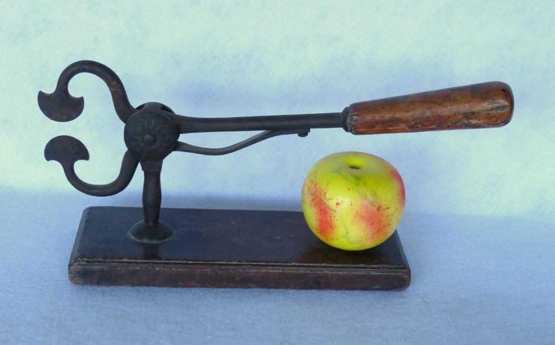 An early sugar cutter with wooden handle mounted on