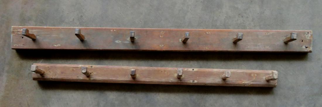 Two early wooden coat racks in natural finish - the: Two early wooden coat racks in natural finish - the wooden pegs are mortised through the back boards - mid to late 19th century - very good condition - 40 3/4"L & 50 1/2"L.