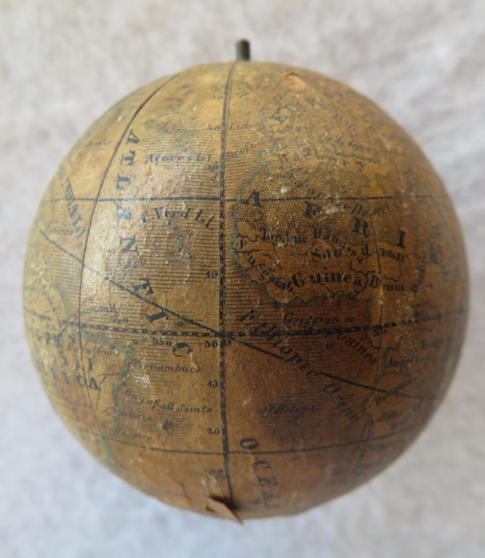 Miniature German pocket globe marked "The Earth /: Miniature German pocket globe marked "The Earth / Published by / J.G. / Klinger / in / Nuremberg" - Johann Georg Klinger, Nuremberg Germany, early to mid 19th century. Appears to be lithographed paper