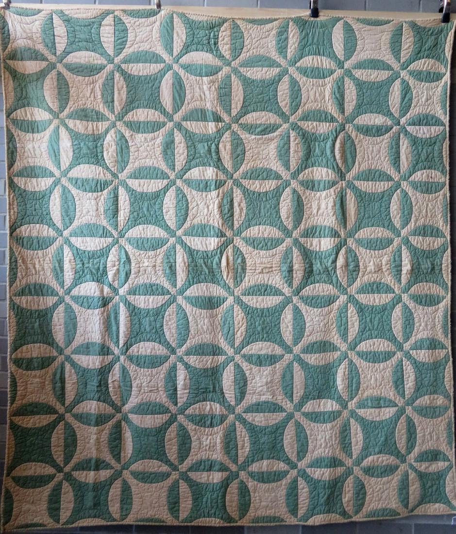 Applique quilt in green and white - all hand sewn. 64": Applique quilt in green and white - all hand sewn. 64" x 71". White background with slight darkening, minor use wear around perimeter, and overall good condition. Early 20th century.