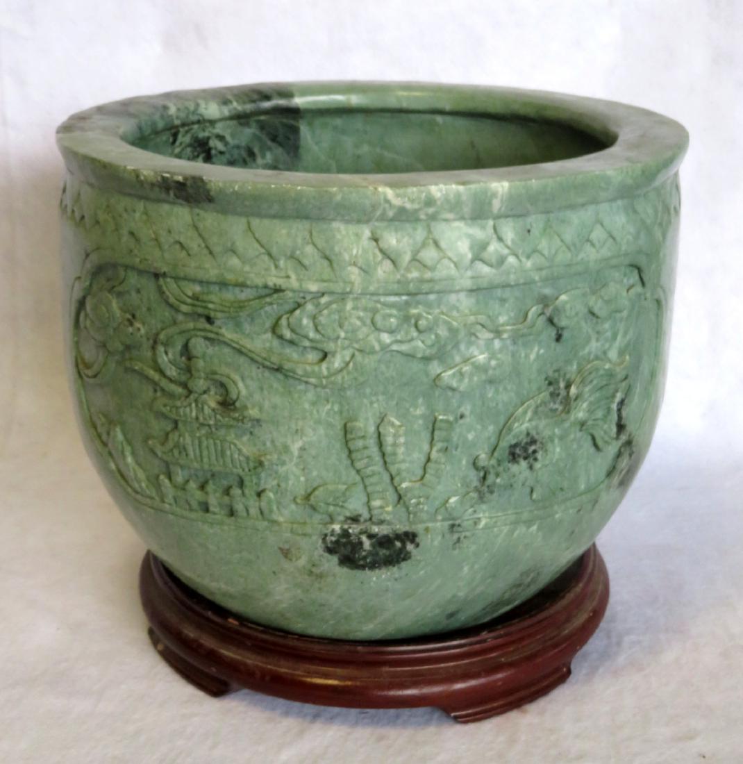 Carved marbleized stone planter, jade colored. Probably: Carved marbleized stone planter, jade colored. Probably late 20th century. 12"H x 15 1/2"D. Small tight hairline on rim, else very good condition. Provenance: From a private collection of Country Amer