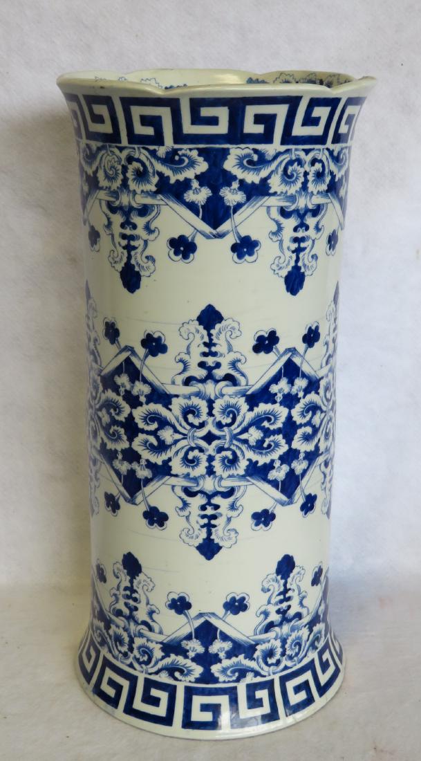 A very fine oriental blue and white umbrella stand: A very fine oriental blue and white umbrella stand having a Greek Key design across the top and base and the center decorated with flowers, scrolls, and geometrics. Very good condition. Probably mid 1