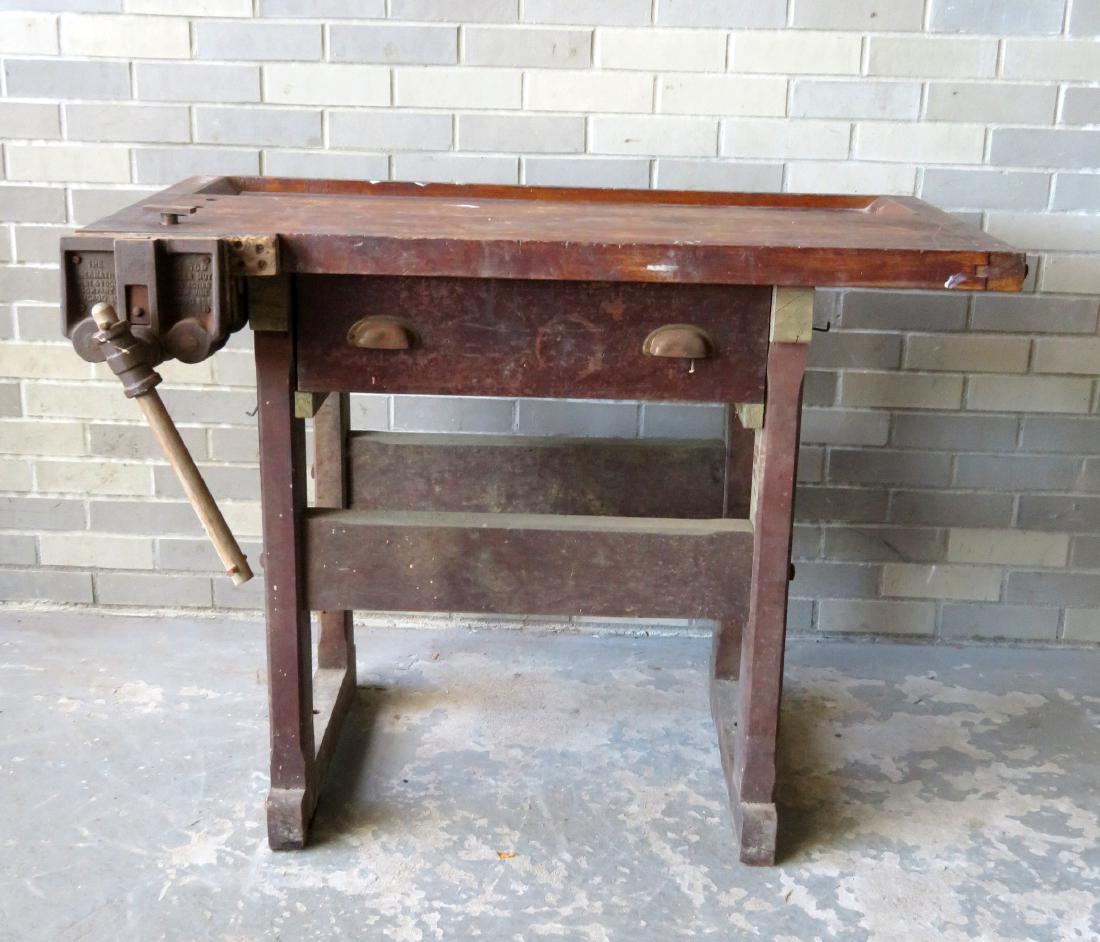 Carpenter's maple work bench with attached iron vise: Carpenter's maple work bench with attached iron vise signed "The Bernathy Vice & Tool Company, Chicago Ill.", and having legs mortised into the shoe foot base. Some use wear, but overall good conditio