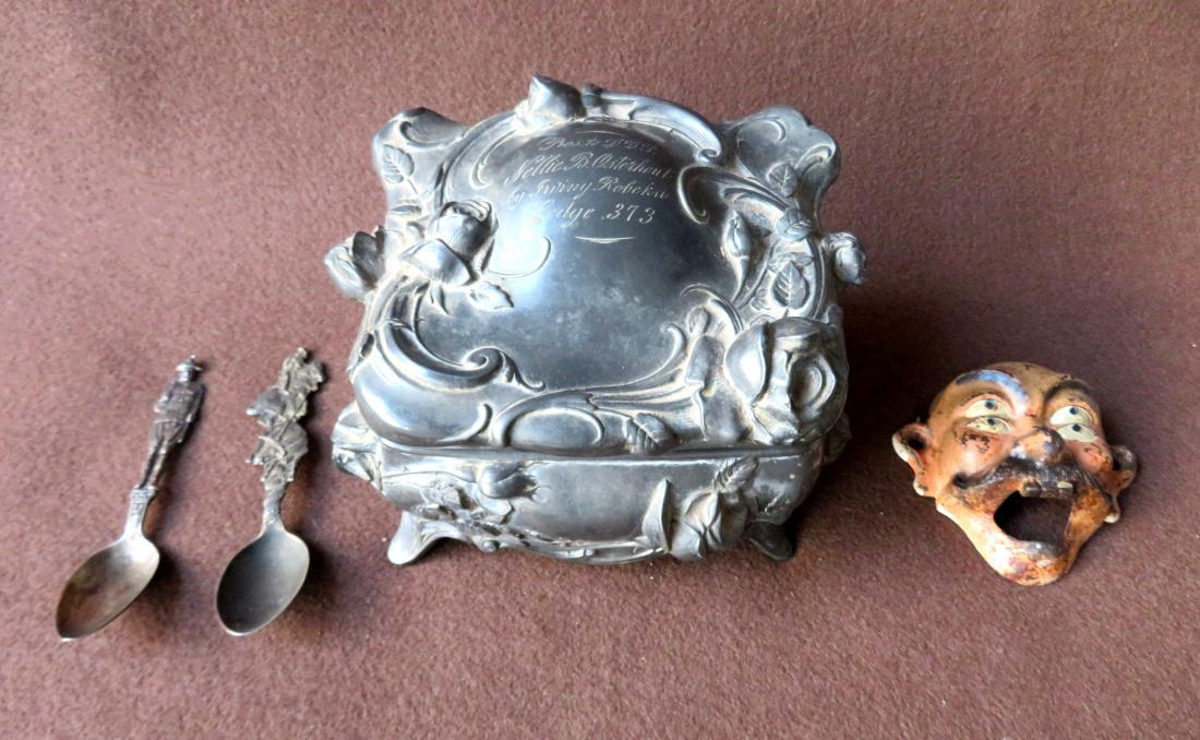 Grouping of decorative objects including a cast iron: Grouping of decorative objects including a cast iron figural bottle opener in the form of a whimsical man with 4 eyes, in original paint, signed Wilton on reverse, a sterling WWI figural soldier tea s