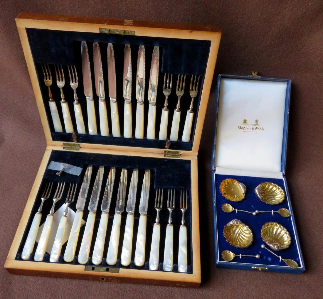 Two boxes sets of silver including: 1) Four silver: Two boxes sets of silver including: 1) Four silver shell shaped salts with shell shaped salt spoons, all with gold wash and hallmarked on base - excellent condition in original Mappin & Webb box; 2) A