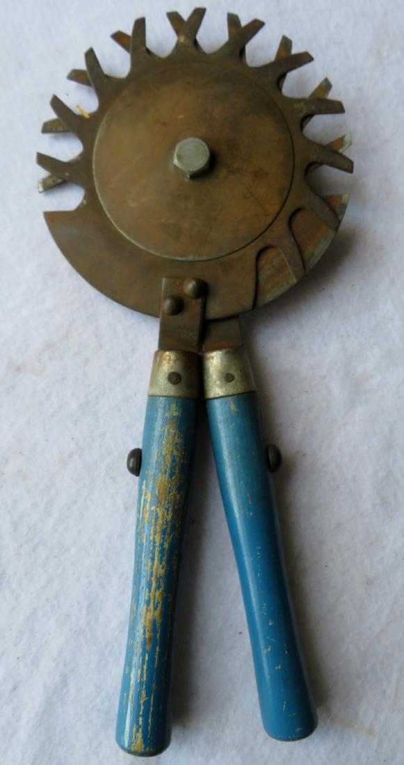 A cast iron tool with 12 cutting edges and having blue