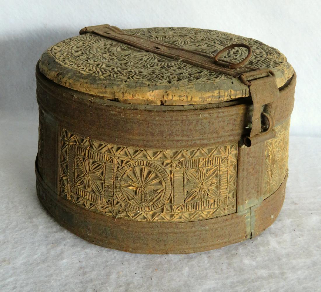 Early pantry box with hinged lid and extensive carving: Early pantry box with hinged lid and extensive carving of pinwheels and geometrics throughout - cork or corkwood construction with the sides all 1 piece and the separate base attached to the circular 