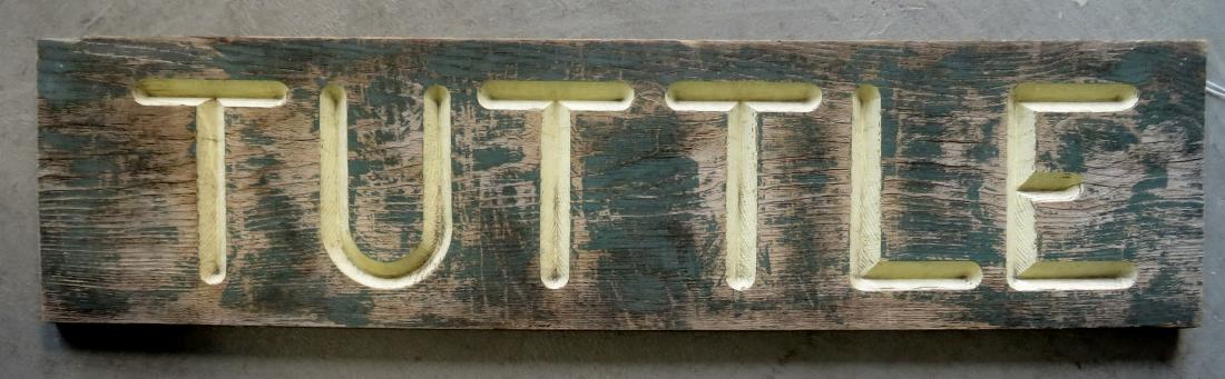 Old wooden signed with dug lettering in original yellow: Old wooden signed with dug lettering in original yellow paint on a green ground, early 20th century. 37 1/4"W x 9"H x 3/4" thick. Some weathering to the green paint, but overall good condition.