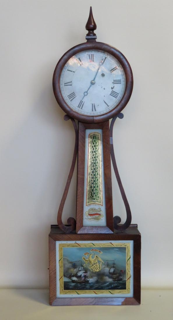 Early American banjo wall clock with round face and 2: Early American banjo wall clock with round face and 2 reverse painted tablets, the lower depicting a sea battle between and US and British frigate - the battle scene is overlaid with a hand painted ea