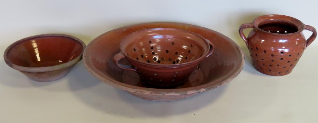Grouping of 4 pieces of redware including: 1) Small: Grouping of 4 pieces of redware including: 1) Small bowl - with interior glaze but no exterior glaze, mid 19th century - very good condition - 9 1/4"D x 3"H - very good condition; 2) Large bowl, 19th