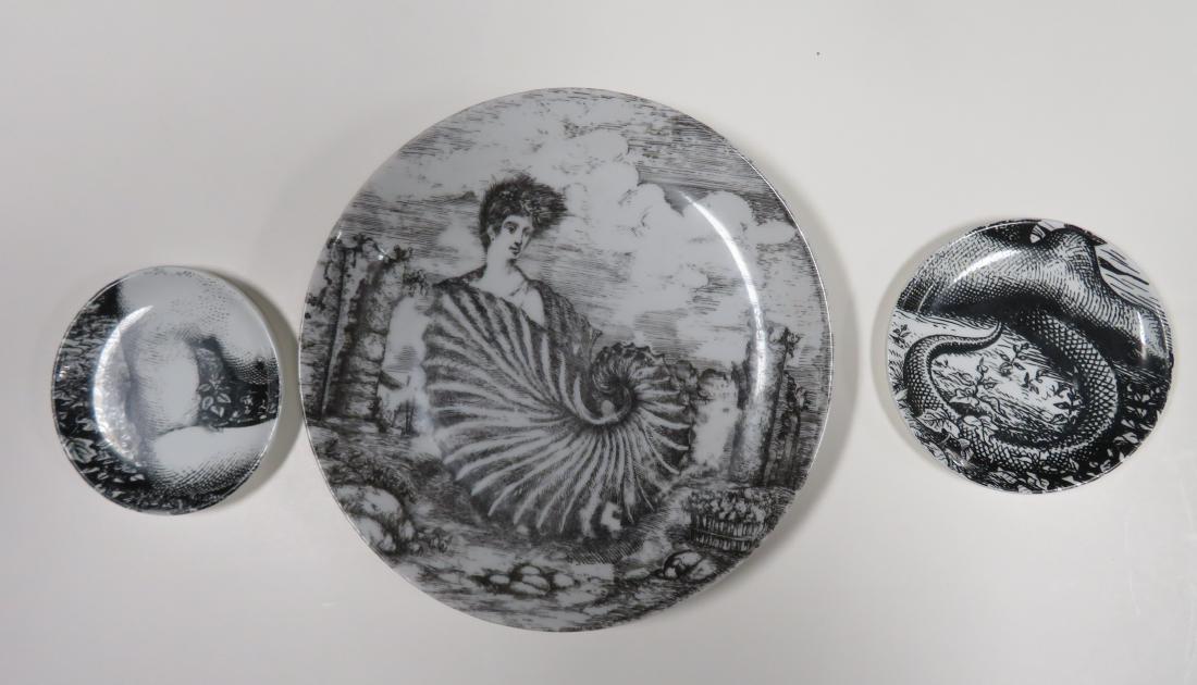 Three Fornasetti design porcelain black on white plates: Three Fornasetti design porcelain black on white plates including one marked "Fornasetti -Milano / Made in Italy / Le-Oceanidi / Exclusive For Tiffany in U.S.A." - 8 1/4"D, and 2 smaller plates marked