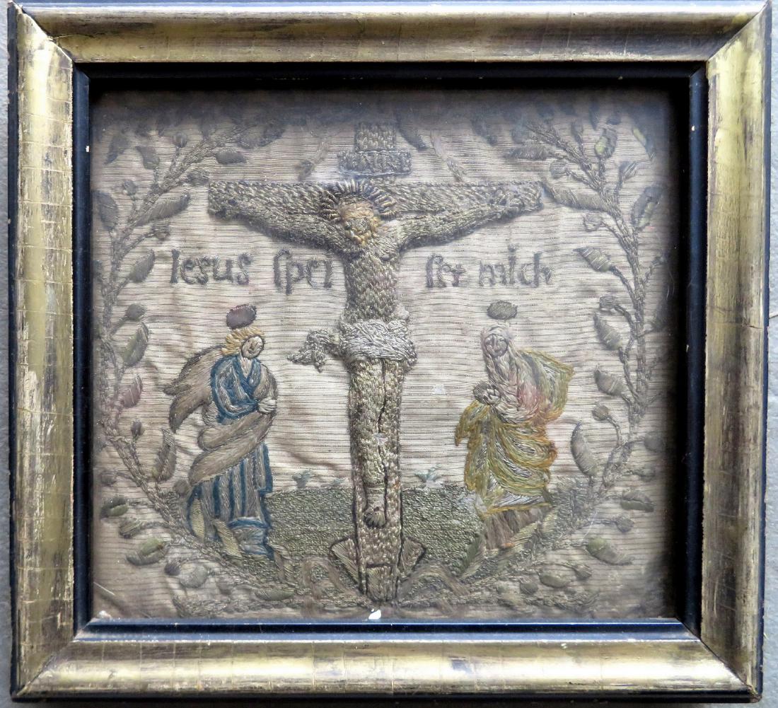 A primitive silk embroidery depicting the crucifixion: A primitive silk embroidery depicting the crucifixion of Christ surrounded by a vine and leaf wreath - embroidered across the front "Jesus xxx xxx mich" probably 16th/17th century German. Frame size 8
