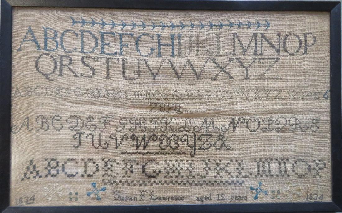 An American alphabet sampler signed "Susan F. Lawrence: An American alphabet sampler signed "Susan F. Lawrence aged 12 years 1834". Small stain near bottom, else very good condition. Sight size 17 1/4 x 10 1/2".