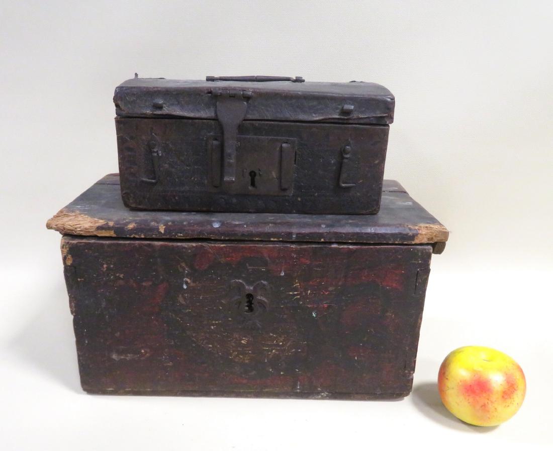 Two primitive wooden document boxes, 17th/18th century.: Two primitive wooden document boxes, 17th/18th century. The first in leather with hand forged iron hardware - 9 3/4"W x 6"D x 4 3/4"H - use wear but in good condition; the second with dovetailed wood