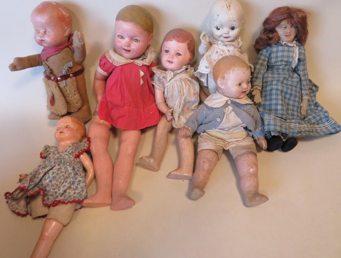 Grouping of old mostly American dolls that have been: Grouping of old mostly American dolls that have been loved and played with. Includes an Ideal sleep eye (discolored eyes) Shirley Temple doll - 22"H, a cowboy doll with nickel plated case iron 6 shoot